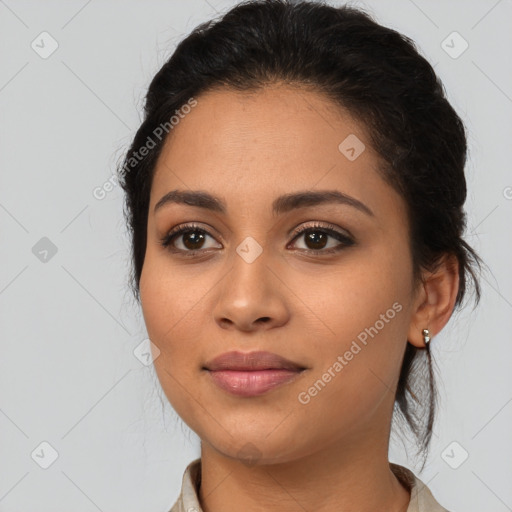 Joyful latino young-adult female with medium  brown hair and brown eyes