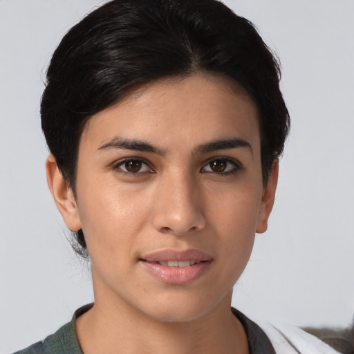 Joyful asian young-adult female with short  brown hair and brown eyes