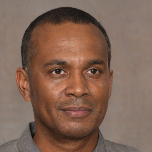 Neutral black adult male with short  brown hair and brown eyes