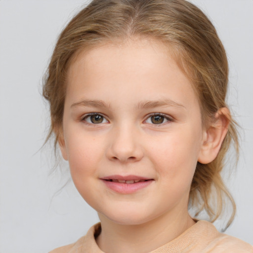 Joyful white child female with medium  brown hair and blue eyes