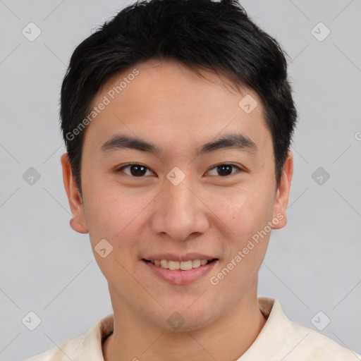 Joyful asian young-adult male with short  brown hair and brown eyes