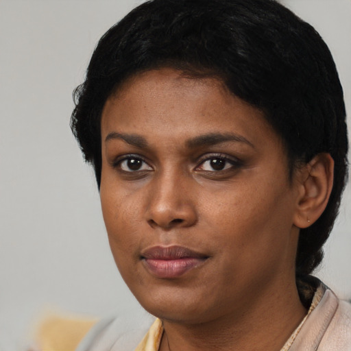 Neutral black young-adult female with short  black hair and brown eyes