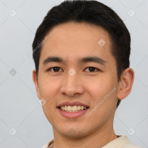 Joyful white young-adult male with short  black hair and brown eyes