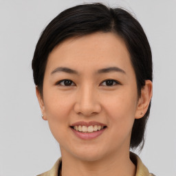 Joyful white young-adult female with medium  brown hair and brown eyes