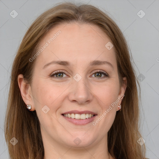 Joyful white adult female with long  brown hair and grey eyes