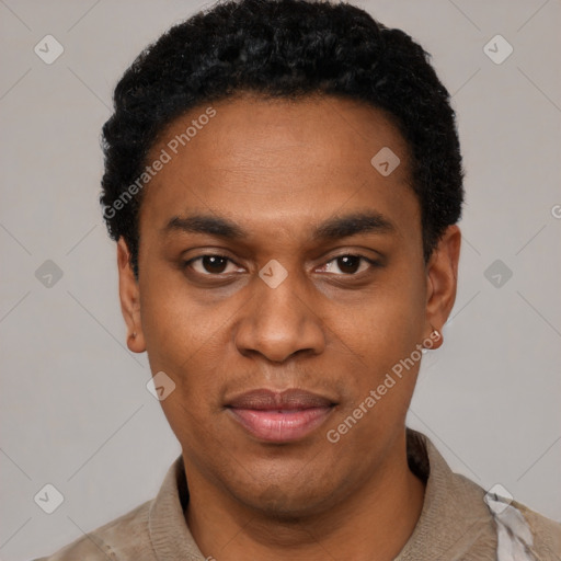 Joyful black young-adult male with short  black hair and brown eyes