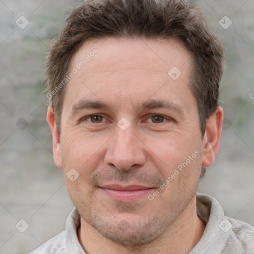 Joyful white adult male with short  brown hair and grey eyes