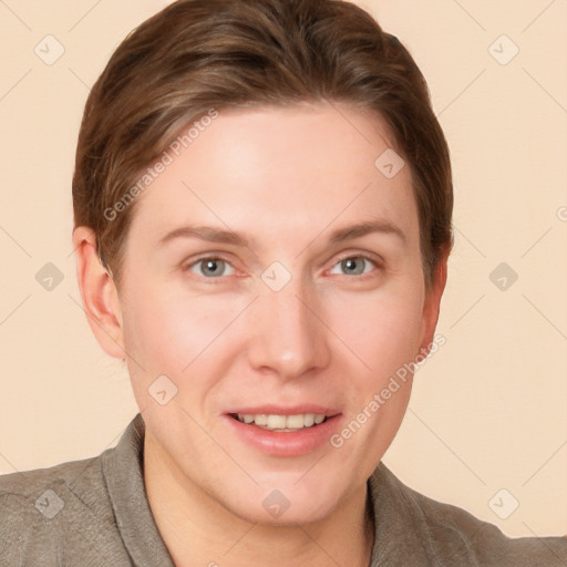 Joyful white young-adult female with short  brown hair and grey eyes