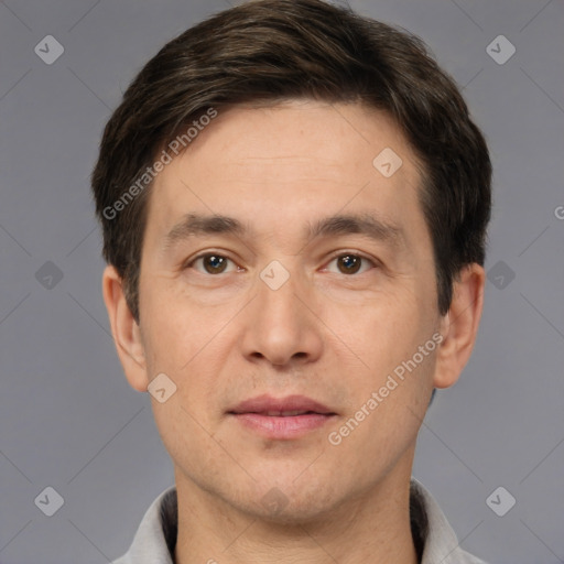 Joyful white adult male with short  brown hair and brown eyes