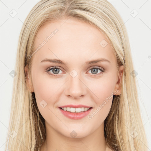 Joyful white young-adult female with long  brown hair and blue eyes