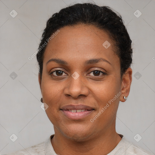 Joyful black young-adult female with short  brown hair and brown eyes