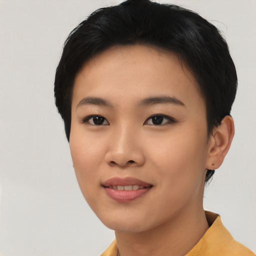 Joyful asian young-adult female with short  black hair and brown eyes