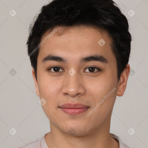 Joyful asian young-adult male with short  black hair and brown eyes