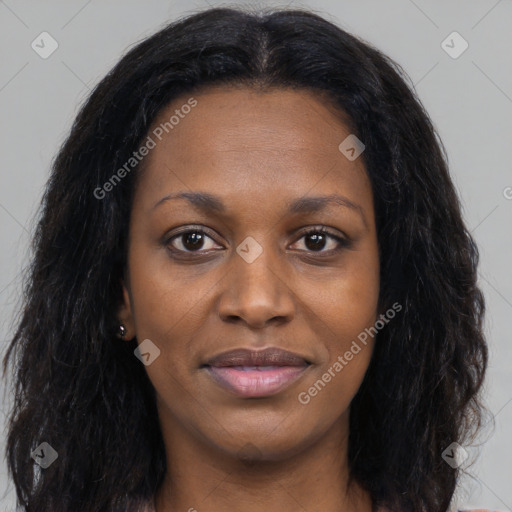 Joyful black young-adult female with long  black hair and brown eyes