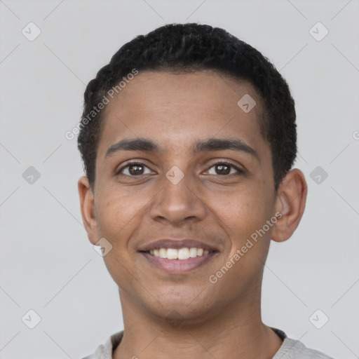 Joyful black young-adult male with short  black hair and brown eyes