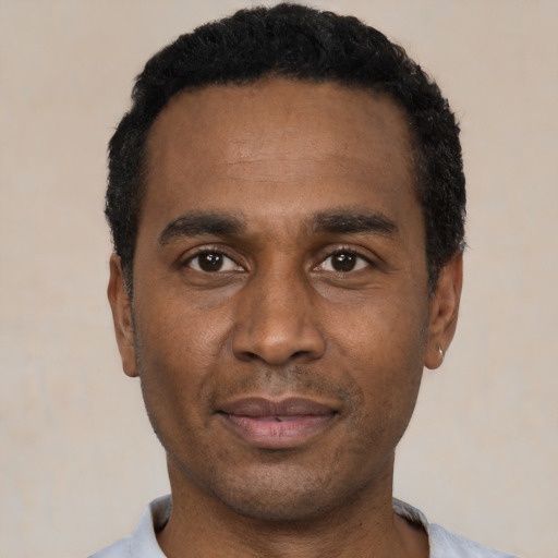 Neutral black adult male with short  black hair and brown eyes