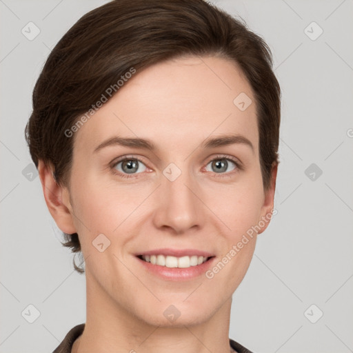 Joyful white young-adult female with short  brown hair and grey eyes