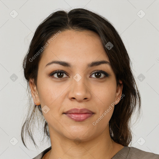 Joyful latino young-adult female with medium  brown hair and brown eyes