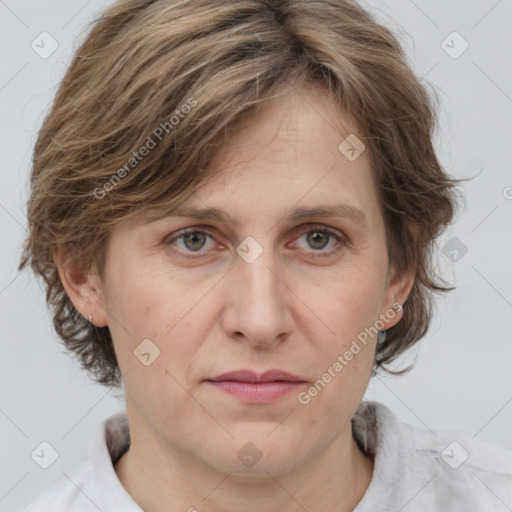 Joyful white adult female with medium  brown hair and grey eyes