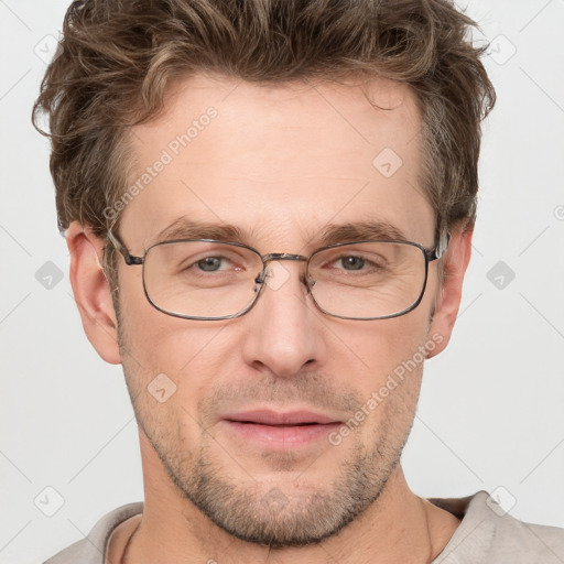 Joyful white adult male with short  brown hair and grey eyes