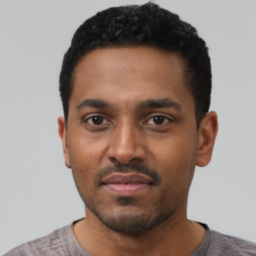 Neutral black young-adult male with short  black hair and brown eyes
