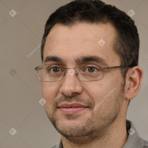 Joyful white adult male with short  brown hair and brown eyes