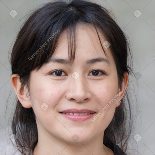 Joyful white adult female with medium  brown hair and brown eyes