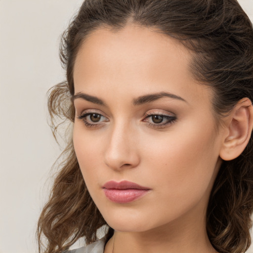 Neutral white young-adult female with long  brown hair and brown eyes