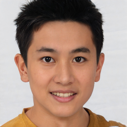 Joyful asian young-adult male with short  brown hair and brown eyes