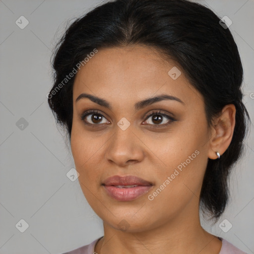 Joyful latino young-adult female with medium  brown hair and brown eyes