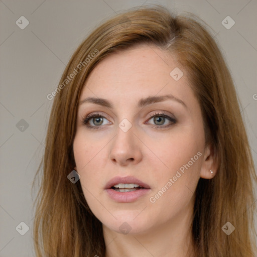 Neutral white young-adult female with long  brown hair and brown eyes