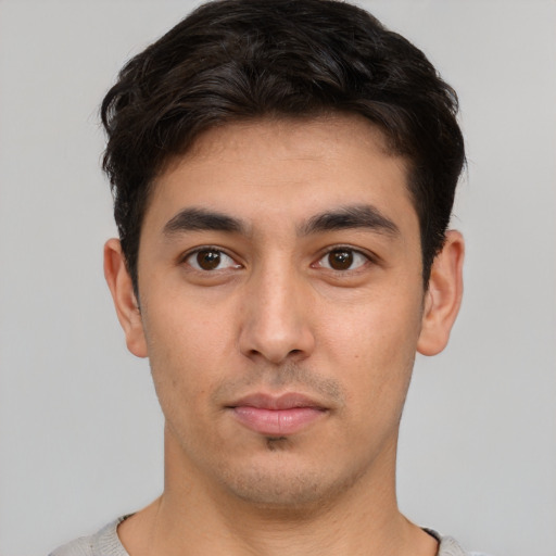 Neutral white young-adult male with short  black hair and brown eyes