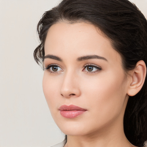 Neutral white young-adult female with long  brown hair and brown eyes