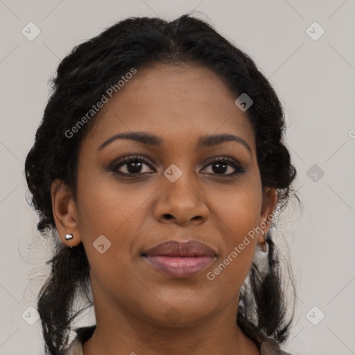 Joyful black young-adult female with long  brown hair and brown eyes