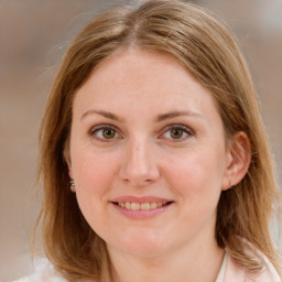 Joyful white young-adult female with medium  brown hair and blue eyes