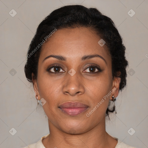 Joyful black young-adult female with medium  black hair and brown eyes