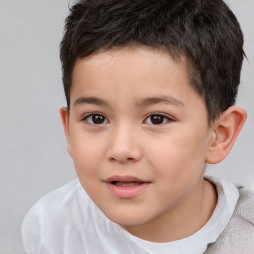 Joyful white child male with short  brown hair and brown eyes