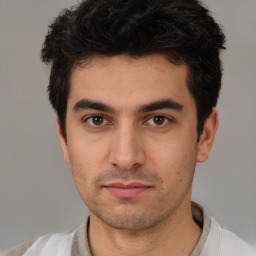 Neutral white young-adult male with short  black hair and brown eyes