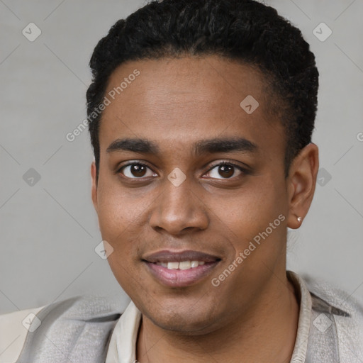 Joyful black young-adult male with short  black hair and brown eyes