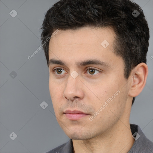 Neutral white young-adult male with short  black hair and brown eyes