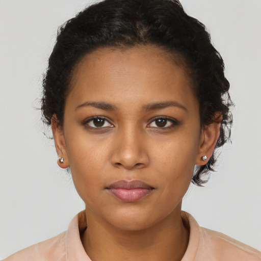 Neutral black young-adult female with short  brown hair and brown eyes