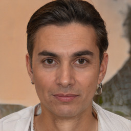 Joyful white adult male with short  brown hair and brown eyes