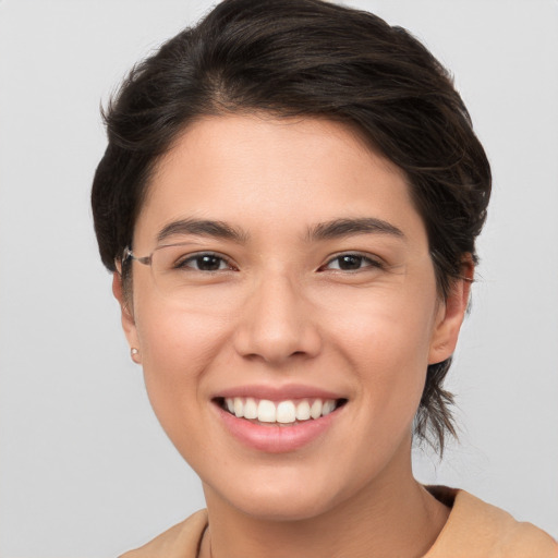 Joyful white young-adult female with medium  brown hair and brown eyes