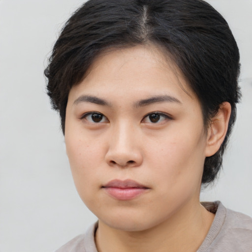 Neutral asian young-adult female with short  brown hair and brown eyes