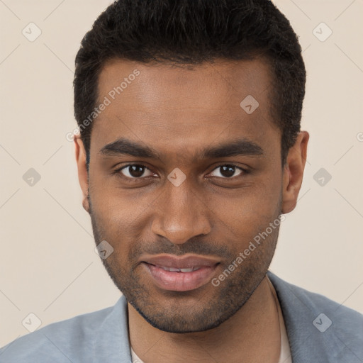 Joyful black young-adult male with short  brown hair and brown eyes