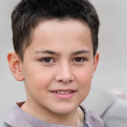 Joyful white child male with short  brown hair and brown eyes