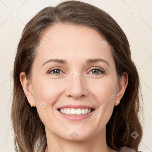 Joyful white young-adult female with medium  brown hair and grey eyes