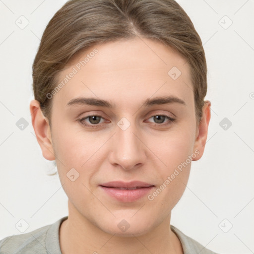 Joyful white young-adult female with short  brown hair and grey eyes