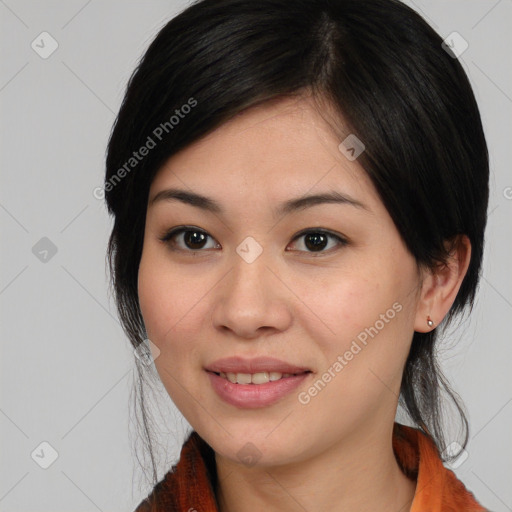 Joyful asian young-adult female with medium  black hair and brown eyes