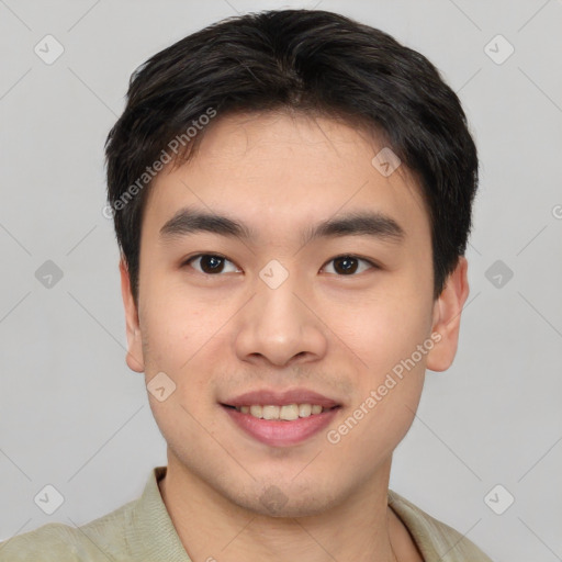 Joyful white young-adult male with short  black hair and brown eyes